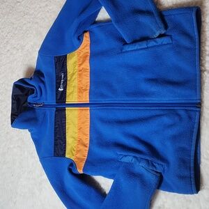 Cotopaxi Blue Fleece Jacket with Yellow and Orange Accents